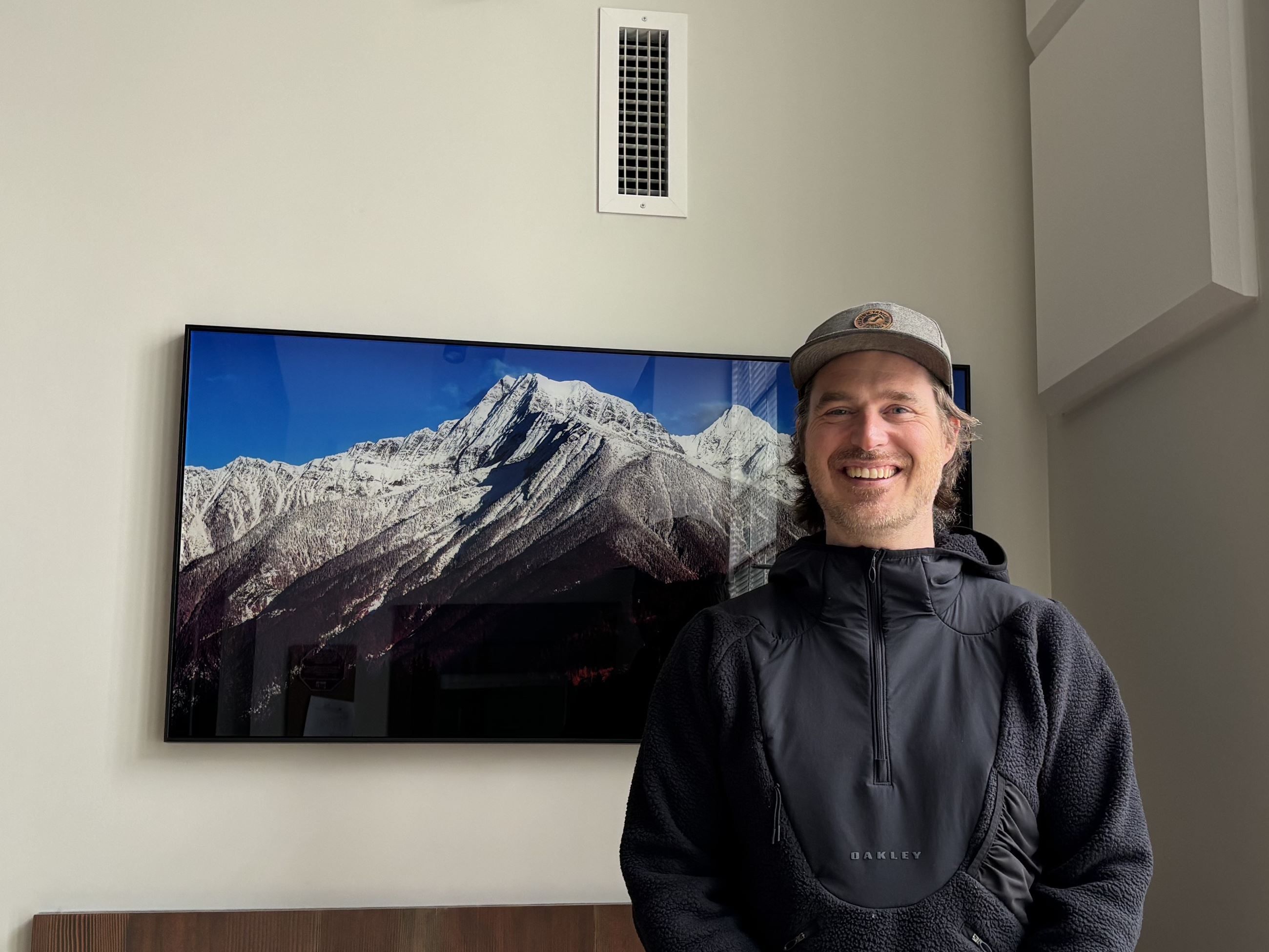 Dan Stewart Next to His Artwork, "Albert Peaks"
